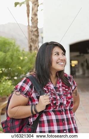 Young smiling woman looking away View Large Photo Image Picture - Young smiling woman looking away. Fotosearch
