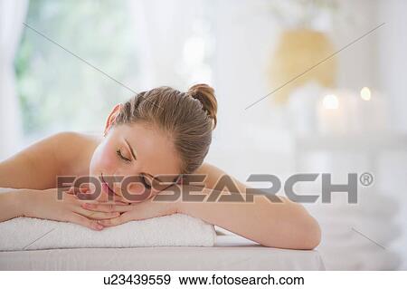 Stock Photo - Young woman relaxing in beauty spa. Fotosearch