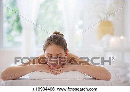 Stock Photograph - Young woman relaxing in beauty spa. Fotosearch