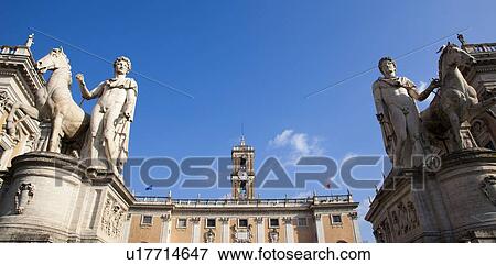 Stock Photo - Ancient statues and clock tower. Fotosearch