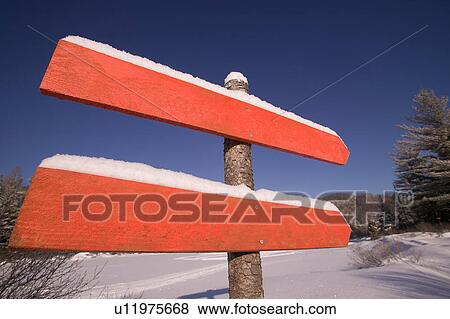 Stock Photo - Blank signposts in snowy field. Fotosearch