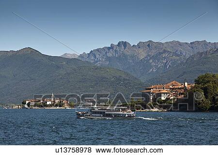Boat sailing in rural bay View Large Photo Image Stock Photo - Boat sailing in rural bay. Fotosearch