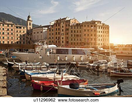 Boats docked in urban pier View Large Photo Image Stock Image - Boats docked in urban pier. Fotosearch