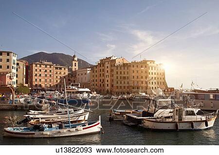 Boats docked in urban pier View Large Photo Image Stock Image - Boats docked in urban pier. Fotosearch