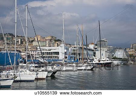 Boats docked in urban pier View Large Photo Image Stock Photo - Boats docked in urban pier. Fotosearch
