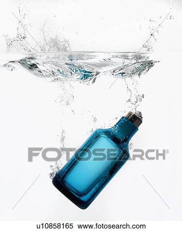 Bottle splashing in water View Large Photo Image Stock Photography - Bottle splashing in water. Fotosearch