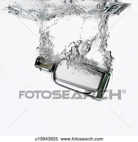 Bottle splashing in water View Large Photo Image Stock Photography - Bottle splashing in water. Fotosearch