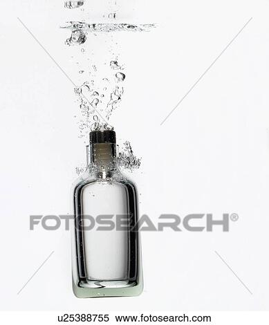 Bottle splashing in water View Large Photo Image Stock Photography - Bottle splashing in water. Fotosearch