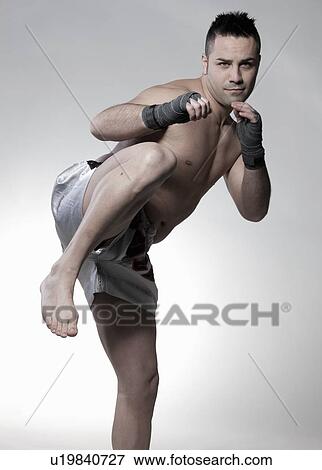 Boxer jabbing and kicking View Large Photo Image Stock Photo - Boxer jabbing and kicking. Fotosearch
