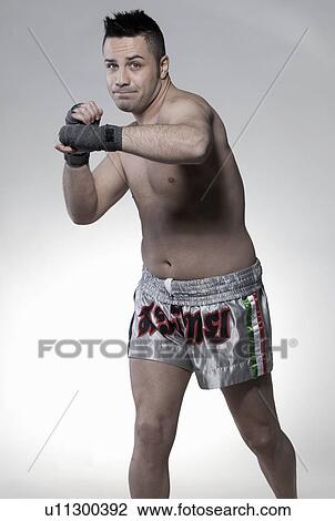 Boxer jabbing with arm View Large Photo Image Stock Image - Boxer jabbing with arm. Fotosearch