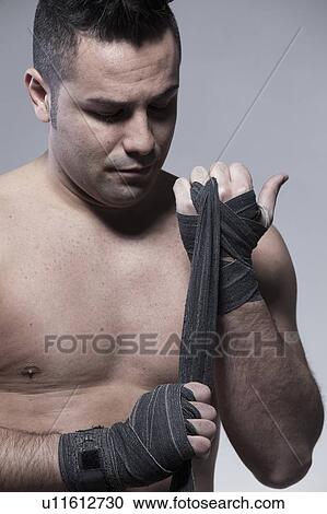 Boxer wrapping his hands View Large Photo Image Stock Image - Boxer wrapping his hands. Fotosearch