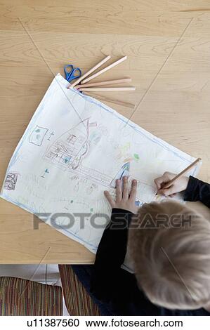 Boy drawing with colored pencils View Large Photo Image Stock Image - Boy drawing with colored pencils. Fotosearch