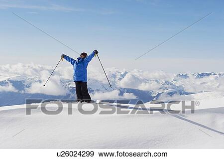 Boy holding ski poles in snow View Large Photo Image Stock Photo - Boy holding ski poles in snow. Fotosearch