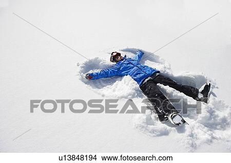 Boy making snow angel View Large Photo Image Picture - Boy making snow angel. Fotosearch