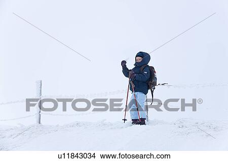 Boy snowshoeing on snowy hillside View Large Photo Image Picture - Boy snowshoeing on snowy hillside. Fotosearch