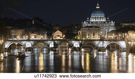 Stock Image - Bridge in the Vatican lit up at night. Fotosearch