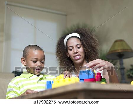 Brother and sister playing with Legos View Large Photo Image Stock Photography - Brother and sister playing with Legos. Fotosearch