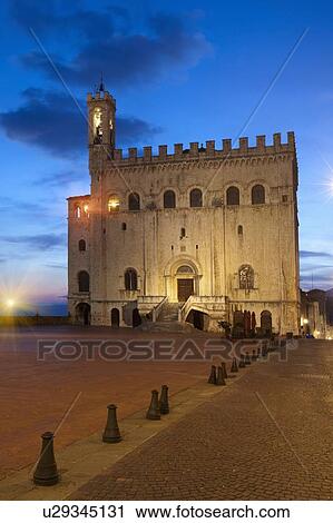 Stock Image - Building and tower lit up at night. Fotosearch