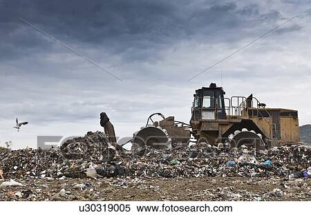 Bulldozer at garbage collection center View Large Photo Image Stock Photography - Bulldozer at garbage collection center. Fotosearch