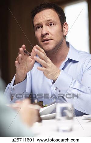 Business people talking in cafe View Large Photo Image Stock Image - Business people talking in cafe. Fotosearch
