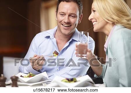 Business people talking in cafe View Large Photo Image Stock Photo - Business people talking in cafe. Fotosearch