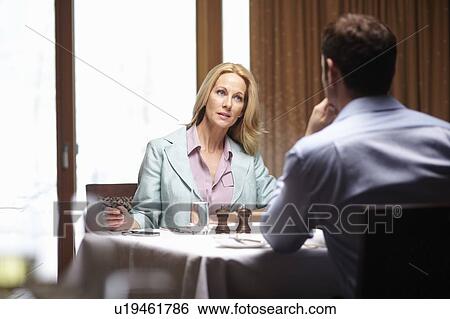Business people talking in cafe View Large Photo Image Stock Photograph - Business people talking in cafe. Fotosearch