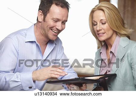 Business people using tablet computer View Large Photo Image Picture - Business people using tablet computer. Fotosearch