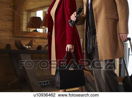 Business people walking in hotel lobby View Large Photo Image Stock Image - Business people walking in hotel lobby. Fotosearch