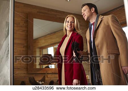 Stock Photograph - Business people walking in hotel lobby. Fotosearch