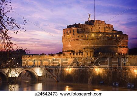 Stock Image - Castel SantíAngelo lit up at night. Fotosearch