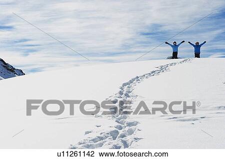 Children cheering on snowy mountaintop View Large Photo Image Stock Image - Children cheering on snowy mountaintop. Fotosearch