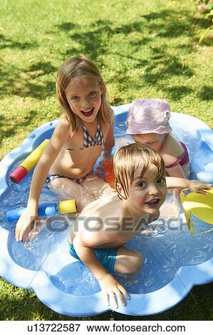 Children playing in wading pool View Large Photo Image Stock Photo - Children playing in wading pool. Fotosearch