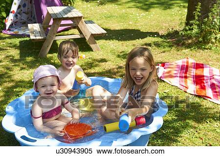 Children playing in wading pool View Large Photo Image Stock Photography - Children playing in wading pool. Fotosearch