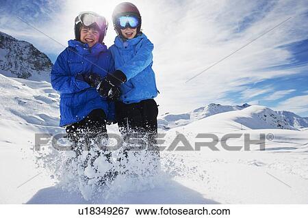 Children playing together in snow View Large Photo Image Stock Photo - Children playing together in snow. Fotosearch