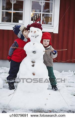 Children standing with snowman View Large Photo Image Stock Image - Children standing with snowman. Fotosearch