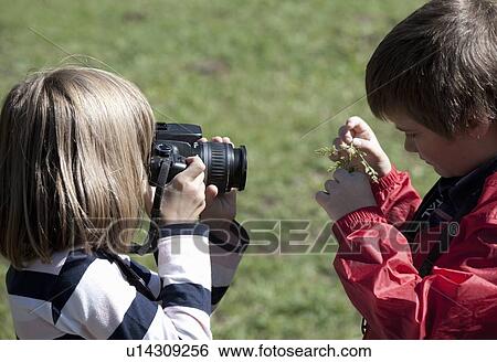 Children taking pictures outdoors View Large Photo Image Stock Photograph - Children taking pictures outdoors. Fotosearch
