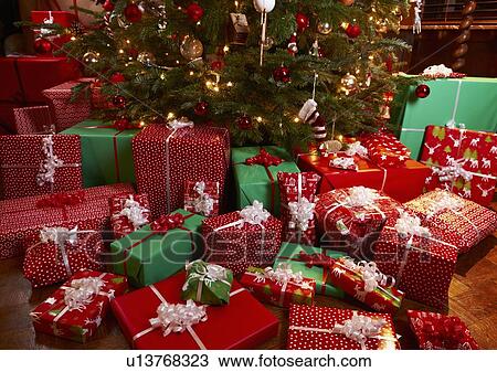 Christmas gifts under tree View Large Photo Image Stock Image - Christmas gifts under tree. Fotosearch