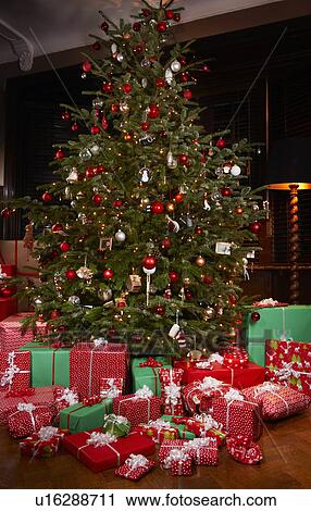 Christmas gifts under tree View Large Photo Image Stock Image - Christmas gifts under tree. Fotosearch