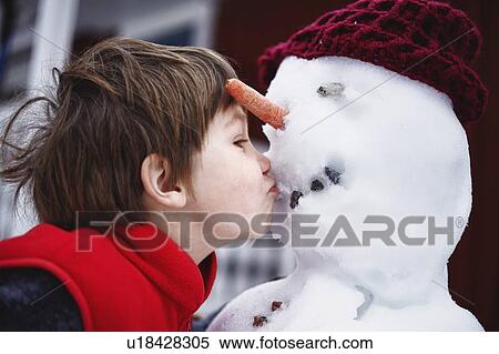 Close up of boy kissing snowman View Large Photo Image Stock Photography - Close up of boy kissing snowman. Fotosearch