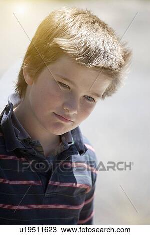 Close up of boys serious face View Large Photo Image Stock Image - Close up of boys serious face. Fotosearch