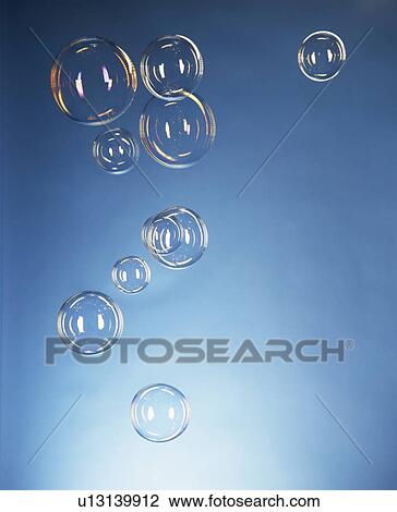 Close up of bubbles against blue wall View Large Photo Image Stock Image - Close up of bubbles against blue wall. Fotosearch