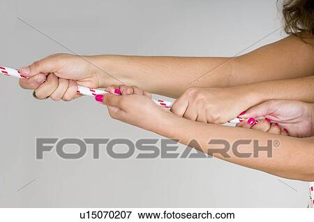 Close up of hands pulling rope View Large Photo Image Stock Photo - Close up of hands pulling rope. Fotosearch