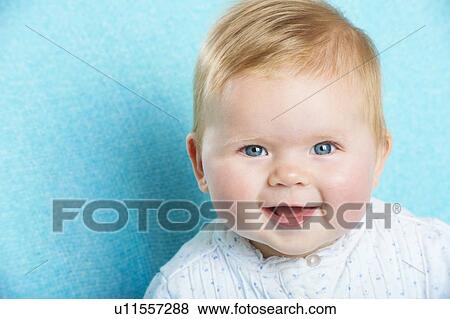Stock Photo - Close up of infants smiling face. Fotosearch