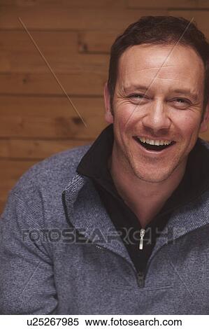 Stock Photography - Close up of man laughing. Fotosearch
