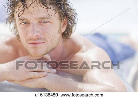 Close up of man resting chin on hands View Large Photo Image Stock Image - Close up of man resting chin on hands. Fotosearch