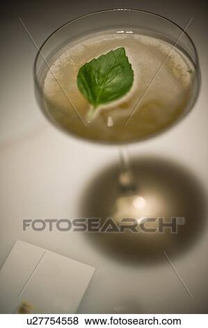 Stock Photo - Close up of mint leaf in cocktail. Fotosearch