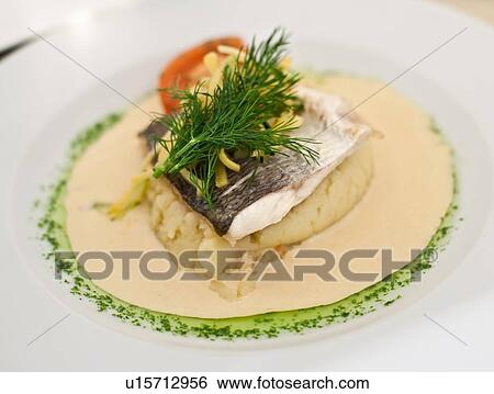 Close up of plate of fish and potatoes View Large Photo Image Stock Photograph - Close up of plate of fish and potatoes. Fotosearch
