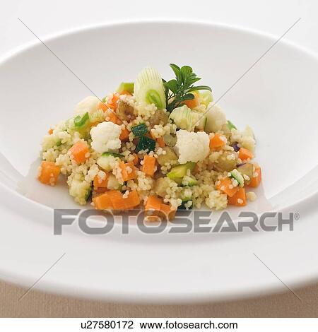 Stock Image - Close up of plate of Sardinian couscous. Fotosearch