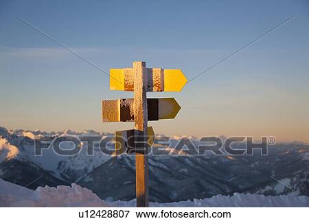 Stock Photo - Close up of rural signposts in snow. Fotosearch