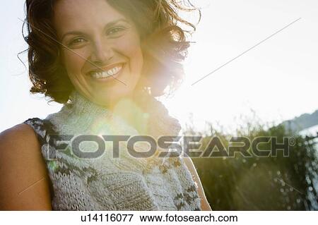 Stock Photo - Close up of smiling womans face. Fotosearch